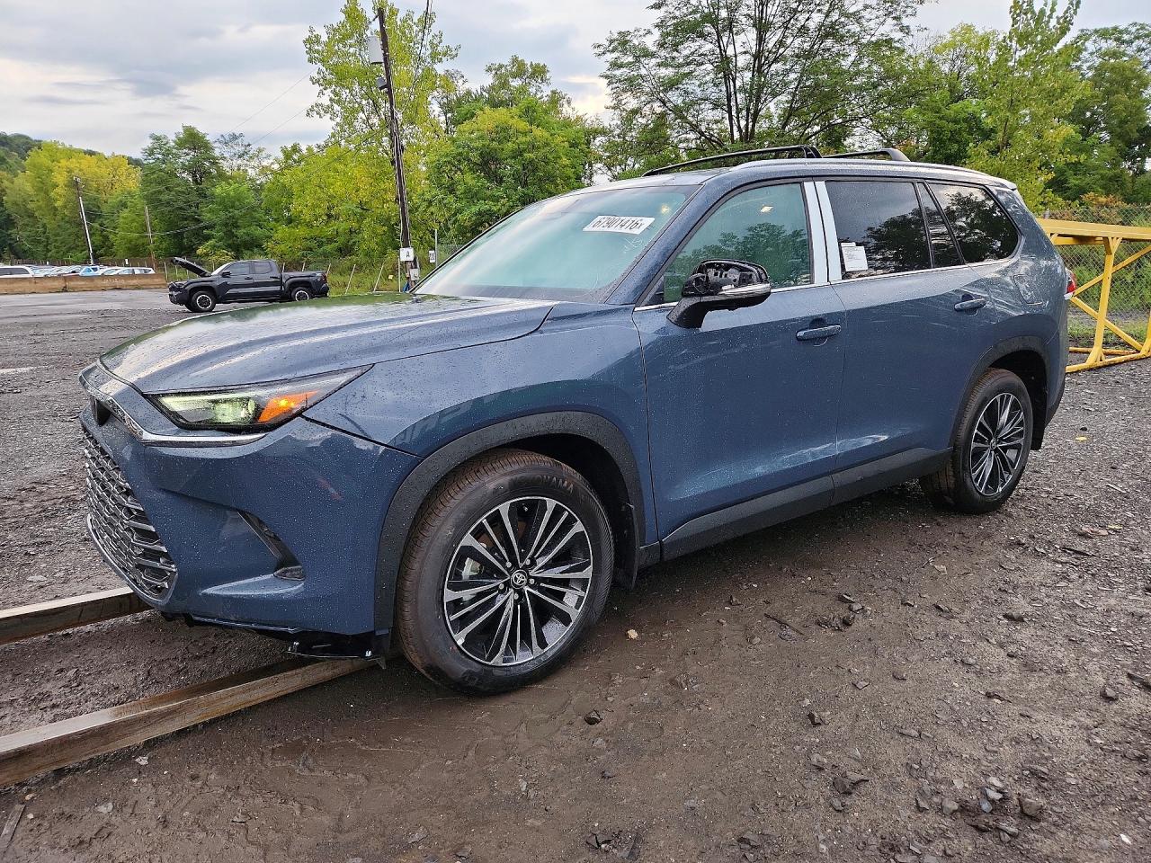 2026 Toyota GRAND HIGHLANDER HYBRID MAX PLATINUM, grau, 282 km, Import USA — Foto 1