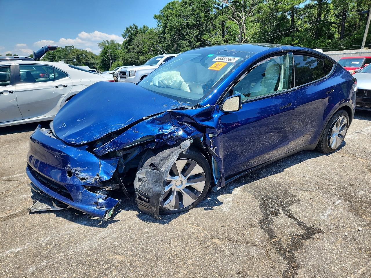 2024 Tesla MODEL Y, blau, Import USA — Foto 1
