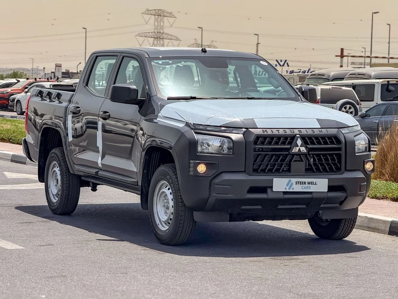 2027 Mitsubishi L200, grau, 0 km, Import VAE — Foto 1
