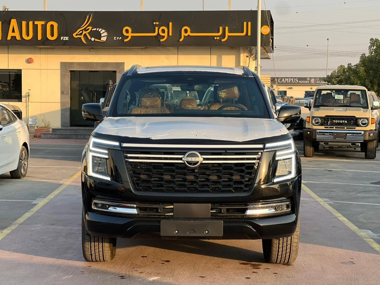 2026 Nissan Patrol LE PLATINUM CITY, schwarz, 0 km, Import VAE — Foto 1