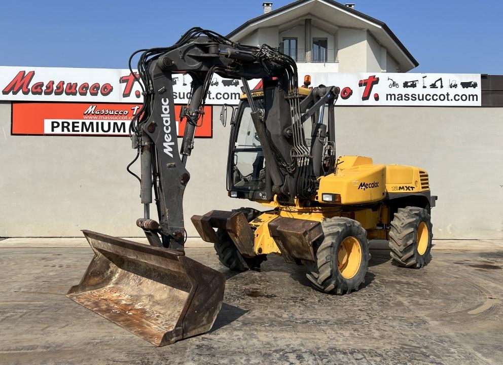 2001 Mecalac 12MXT-E, 6.667 mth, Import Auf Lager in der EU — Foto 1 | AMECAR 2001 Mecalac 12MXT-E, 6.667 mth, Import Auf Lager in der EU — Foto 1
