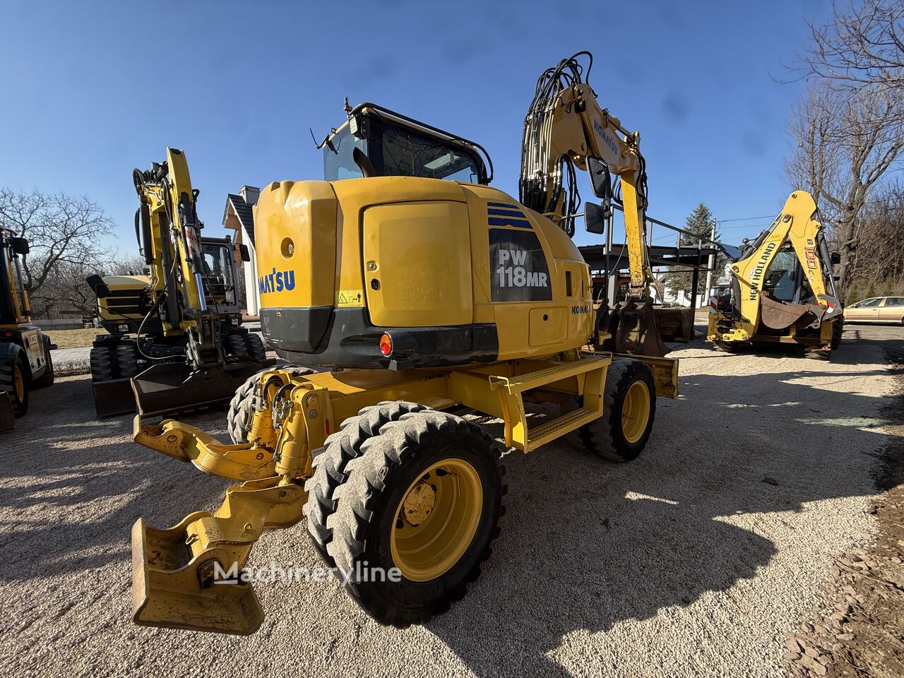 2012 Komatsu PW118, 9.600 mth, Import Auf Lager in der EU — Foto 1 | AMECAR 2012 Komatsu PW118, 9.600 mth, Import Auf Lager in der EU — Foto 1