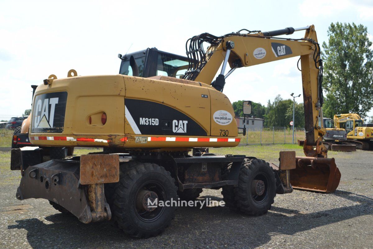 2012 Caterpillar M315D, 14.207 mth, Import Auf Lager in der EU — Foto 6 z 16