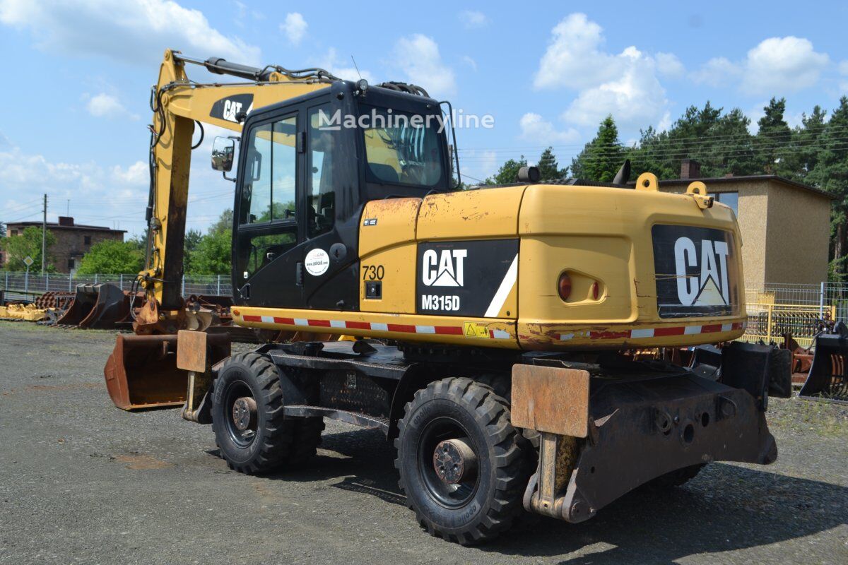 2012 Caterpillar M315D, 14.207 mth, Import Auf Lager in der EU — Foto 8 z 16
